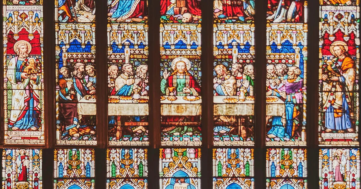 A stained glass window depicting the Last Supper.